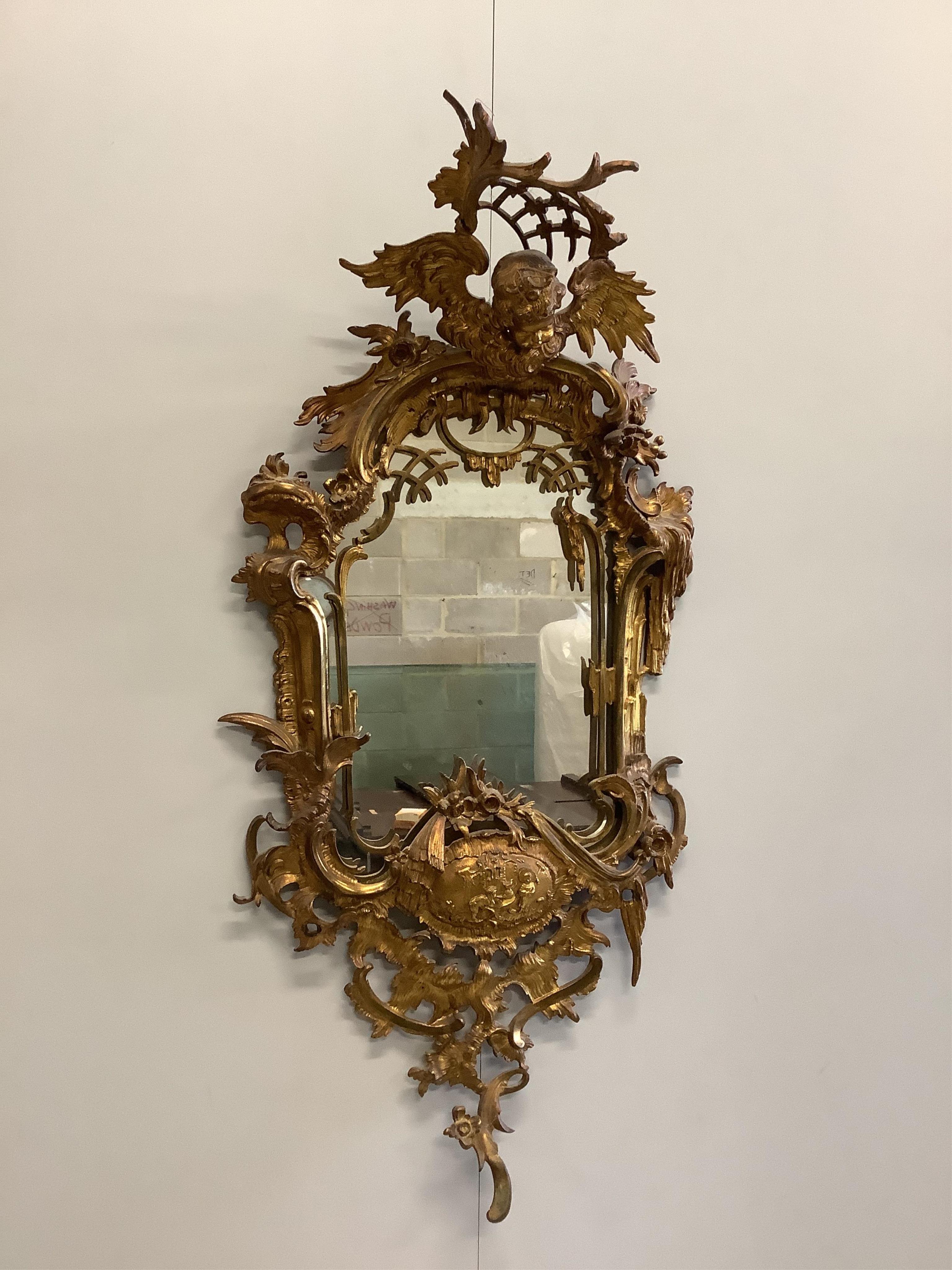 A Chippendale Revival gilt metal wall mirror, width 35cm, height 74cm. Condition - good